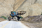 A front-end loader clears debris off National Route 52 after a mudslide between Purmamarca & Salinas Grande, Argentina.