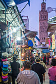 Rabat, Morocco, Apr 24 2015, Shoppers explore colorful stalls filled with handcrafted goods in Rabat\'s Medina at dusk, creating a lively atmosphere in the historic market.