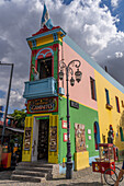 The famous building at the intersection of Caminito & Magallanes Streets in La Boca, Buenos Aires, Argentina. A mannequin of Lionel Messi is on the balcony.