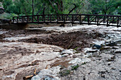 Flash flooding overflowing the banks of Mill Creek after a summer rain storm in Moab, Utah.