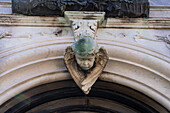 A bas relief cherub over the door of a mausoleum in the Recoleta Cemetery in Buenos Aires, Argentina.