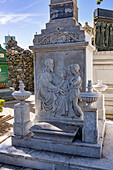 A bas relief sculpture of Christ and little children on a mausoleum in the Recoleta Cemetery in Buenos Aires, Argentina.