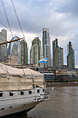 Detail view of the stern of the ARA Presidente Sarmiento, a museum ship in Puerto Madero, Buenos Aires, Argentina. Behind is the skyline of Puerto Madero, including the Alvear Tower, the tallest building in Argentina.