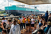 Cargo ship passing through Miraflores Locks in the Panama Canal.