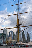 Detail view of the mast of the ARA Presidente Sarmiento, a museum ship in Puerto Madero, Buenos Aires, Argentina. Behind is the skyline of Puerto Madero.