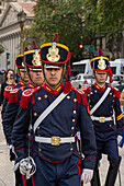 The military honor guard marching from the tomb of San Martin in the Cathedral to the Casa Rosada in Buenos Aires, Argentina. The soldiers are members of the Ayacucho Squadron of the Regiment of Horse Grenadiers.