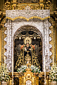 Seville, Spain, Nov 16 2016, The image shows the Virgin Esperanza Macarena statue adorned in mourning attire during November ceremonies in Seville, honoring the departed with ornate religious symbolism.