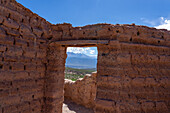 Adobe ruins at the Mirador de la Ventanita de los Valles Calchaquies between Cardones National Park & Payogasta, Argentina. The snow-capped Nevado de Cachi is framed by the doorway.