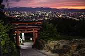 Night views of Kyoto from viewpoint at Fushimi Inari Taisha temple, Kyoto, Japan