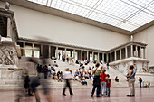 Berlin, Germany, July 24 2009, People engage with the stunning architecture and sculptures of the Pergamon Altar in Berlin’s renowned Pergamon Museum.