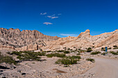 Route 40, an unpaved dirt road through the eroded landscape of the Angastaco Natural Monument in the Calchaqui Valley, Argentina.