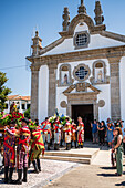 Religious procession enters São João Baptista Church during the Festival of Saint John of Sobrado, also known as Bugiada and Mouriscada de Sobrado, takes place in the form of a fight between Moors and Christians , locally known as Mourisqueiros and Bugios, Sao Joao de Sobrado, Portugal