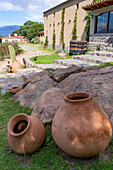 Large clay pots at the Bodega and Finca las Nubes, a winery and vineyard near Cafayate, Argentina.