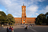 Berlin, Germany, July 21 2009, Visitors stroll around Rotes Rathaus, a historic landmark in Berlin\'s Mitte district, under a beautiful blue sky.