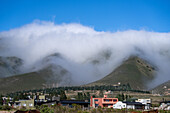 Low clouds blanket the mountains around the town of Tafi in Argentina.