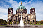 Berlin, Germany, July 24 2009, The stunning facade of Berliner Dom stands majestically at Lustgarten, featuring a fountain and surrounding greenery in Berlin, Germany.