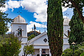 The Cathedral of Our Lady of Candelaria in Humahuaca in the Humahuaca Valley or Quebrada de Humahuaca, Argentina. On the hilltop behind is the Monument to the Heroes of Independence.