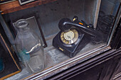 Old telephone in shop display window, Budapest