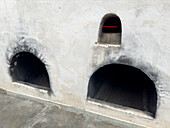 Ovens for heating the fermentation vats in the Museo de la Vid y el Vino or Museum of the Vine and the Wine in Cafayate, Argentina. The museum is housed in a former winery.