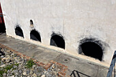 Ovens for heating the fermentation vats in the Museo de la Vid y el Vino or Museum of the Vine and the Wine in Cafayate, Argentina. The museum is housed in a former winery.