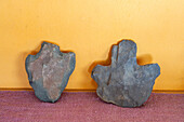 Pre-Hispanic stone ax heads in the studio of indigenous Aymara ceramic artist Santina Alabar in Purmamarca, Argentina.