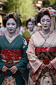 Group of women dressed as Maikos in the streets of Kyoto, Japan