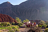 Early morning view of a house on the outskirts of Purmamarca, Argentina.