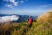 Young man hiking in the mountains of Sierra Nevada de Santa Marta, Colombia