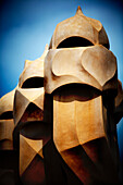 Barcelona, Spain, Sept 4 2008, The unique chimneys of Casa Milà showcase Gaudís architectural genius on Passeig de Gràcia in Barcelona under a clear blue sky.