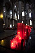 Barcelona, Spain, Sept 4 2008, Votive candles glow softly in the serene atmosphere of Santa María del Mar, enhancing the tranquil setting in Barcelonas historic church.