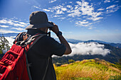 Young man hiking in the mountains of Sierra Nevada de Santa Marta, Colombia