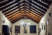 Interior of the Church of Santa Rosa de Lima with its cactus-wood ceiling & Cusco school paintings. Purmamarca, Argentina.