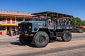 Converted off-road army truck from a tour company in the Fourth of July Parade on Independence Day in Moab, Utah.