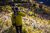 Young man hiking in the mountains of Sierra Nevada de Santa Marta, Colombia