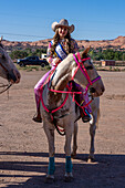 The rodeo queen's 1st Attendant poses on horseback before the Moab Junior Rodeo in Utah.