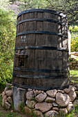 A large wooden wine vat at the Bodega and Finca las Nubes, a winery and vineyard near Cafayate, Argentina.