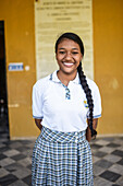 Portrait of young school girl in Quinta de San Pedro Alejandrino, where Simon Bolivar spent his last days, Santa Marta, Colombia