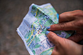 Close up of woman hands holding and pointing a map, Prague