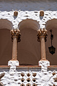 Detail of the Spanish & Moorish-style town hall or cabildo on Plaza Gomez in Humahuaca, Argentina. The capitals of the Moorish tile columns are condor heads carved of stone.