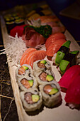 Assorted nigiri and sushi rolls in Sushi restaurant