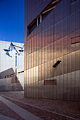 Explore the striking architecture of the Jewish Museum, a modern landmark in Berlin\'s Mitte district reflecting its unique design.