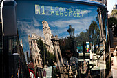 Barcelona, Spain, Sept 4 2008, The airport bus in Barcelona displays reflections of nearby buildings in its window at Plaça de Catalunya.