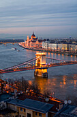 Illuminated Parliament building, Chain Bridge and Danube River at night, Budapest, Hungary, Europe