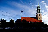 The historic Marienkirche stands prominently in Berlin\'s Mitte district, highlighting its stunning architecture and vibrant surroundings.