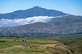 Low clouds blanket the mountains around the town of Tafi in Argentina.