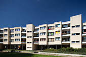 Two rows of modern residential buildings display their unique designs at Mehringplatz in the Friedrichstadt district of Berlin.