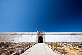 Sagres Fortress stands majestically against a clear blue sky in southern Portugal, highlighting its historic architecture.