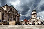 Berlin, Germany, July 24 2009, Gendarmenmarkt square in Berlin features the impressive Konzerthaus and the elegant Französische Dom amidst a dramatic sky.