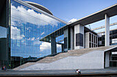 The Marie-Elisabeth-L?ders-Haus stands in Berlin, highlighting contemporary architecture with its striking glass facade and steps.