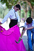 Seville, Spain, May 31 2009, Apprentice bullfighters train with a fake bull in Alameda de Hercules, Seville.